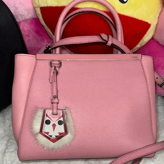 Fendi pink leather petite “2Jours” convertible tote bag with monster bag charm.