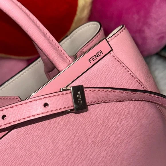Fendi pink leather petite “2Jours” convertible tote bag with monster bag charm.