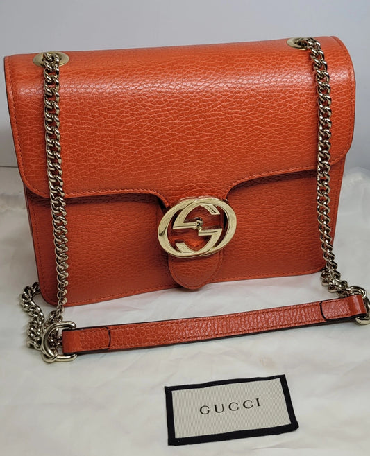 Gucci Dollar Orange Pebbled Leather Interlocking G Handbag