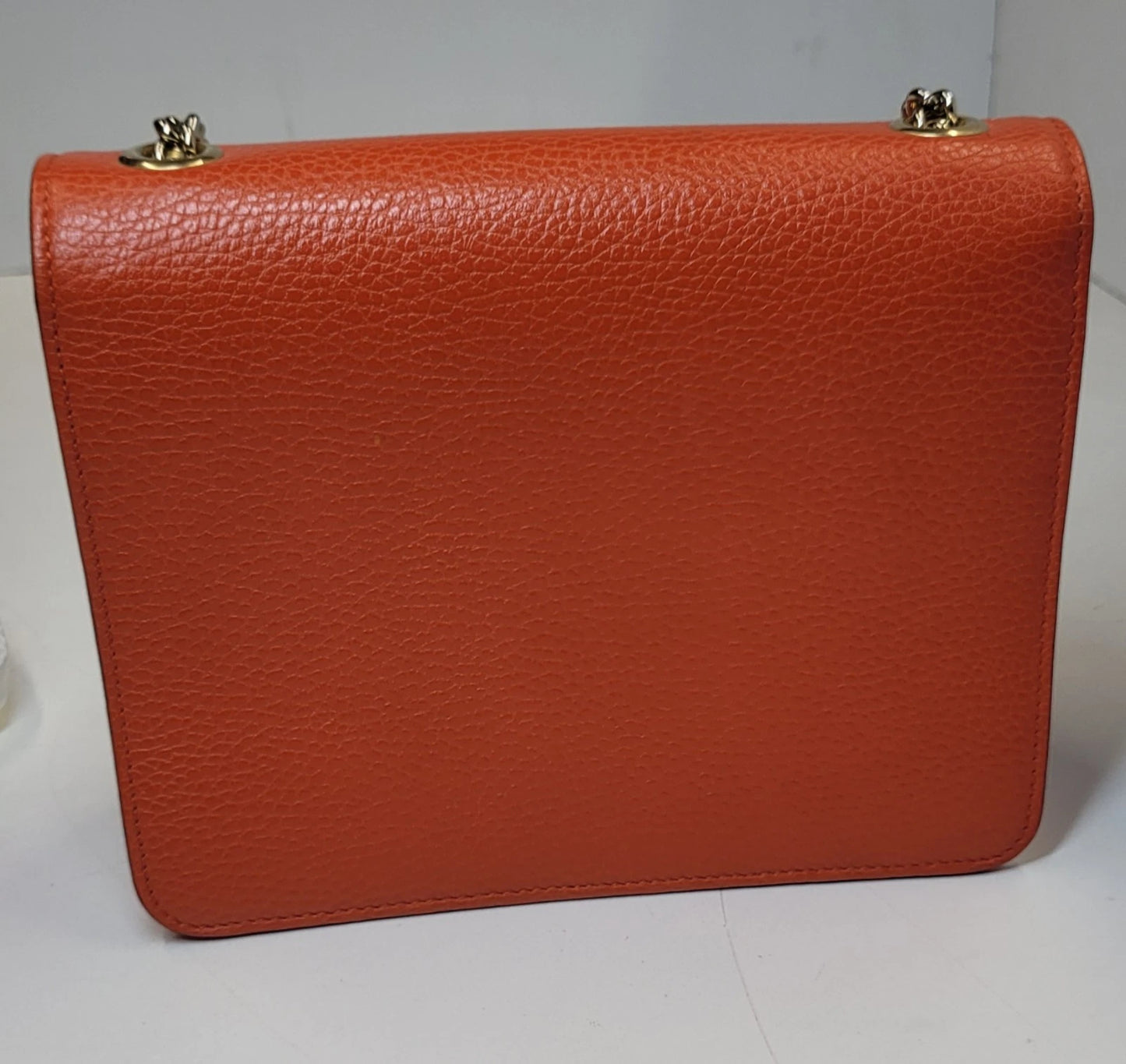 Gucci Dollar Orange Pebbled Leather Interlocking G Handbag