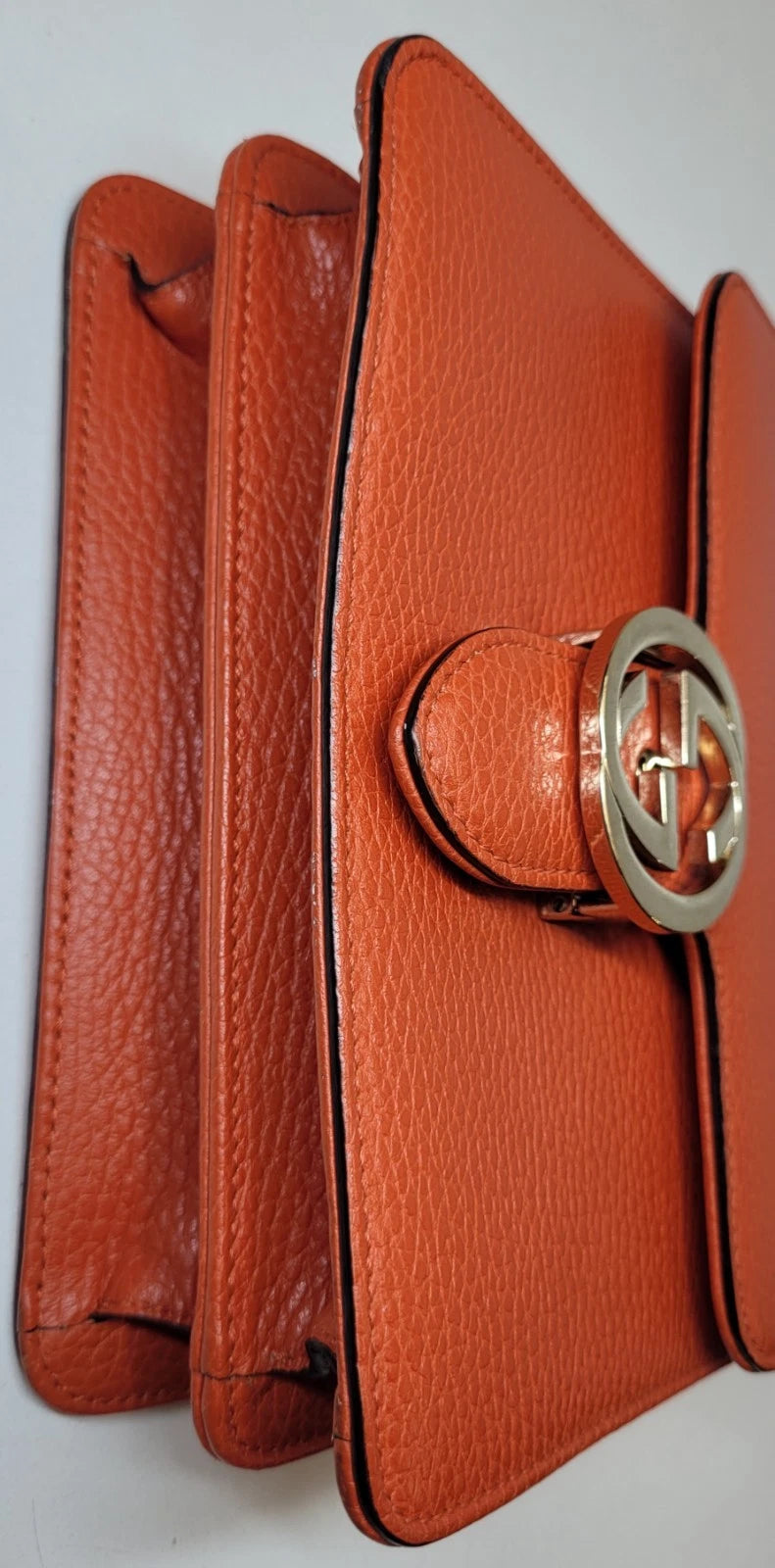 Gucci Dollar Orange Pebbled Leather Interlocking G Handbag