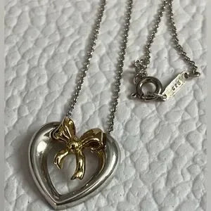 Tiffany 925 sterling silver with 18k gold bow necklace.